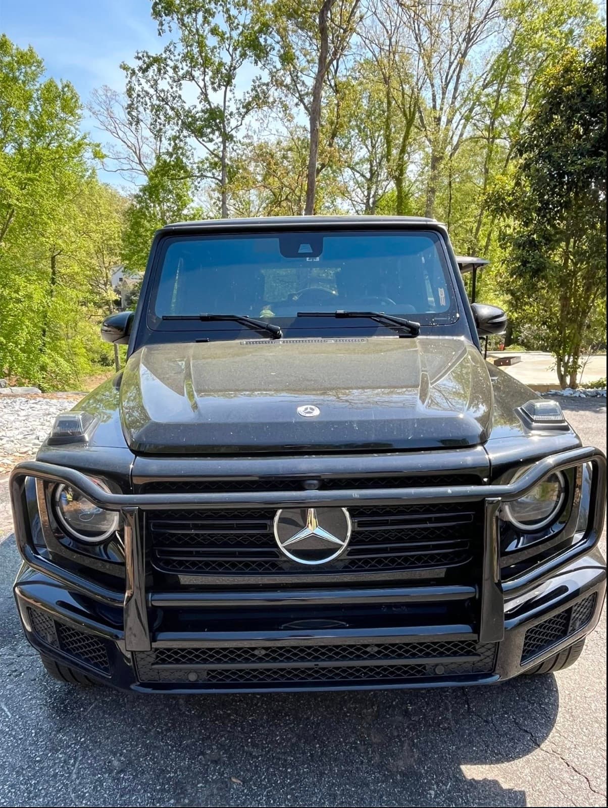 Front grille and headlights of a black Mercedes-Benz G-Wagon after an exterior detail in Stilwell, Kansas.